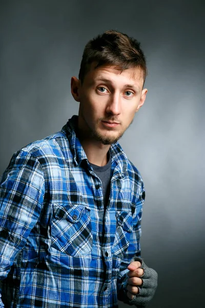 Handsome young man in plaid shirt — Stock Photo, Image