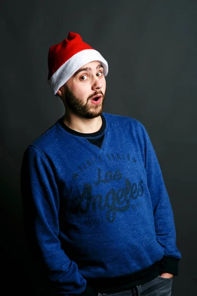 Man in red Christmas hat