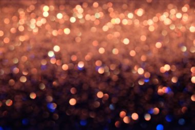 Siyah arkaplanda altın ve mavi ışıklar