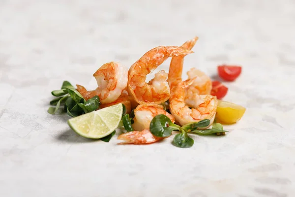 grilled shrimps with salad on white background