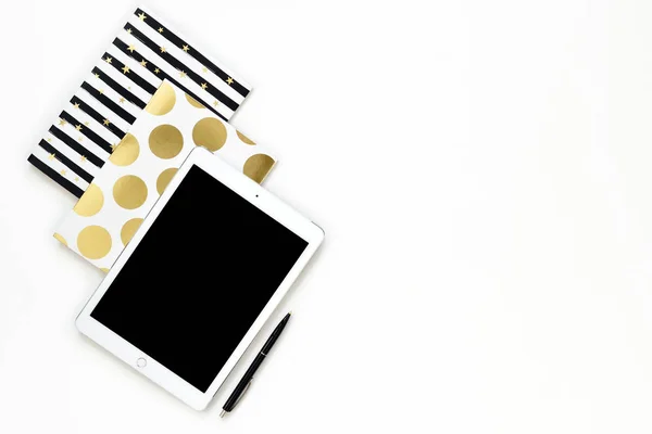 Flat lay photo of office white desk with tablet and gold notebook copy space background — Stock Photo, Image