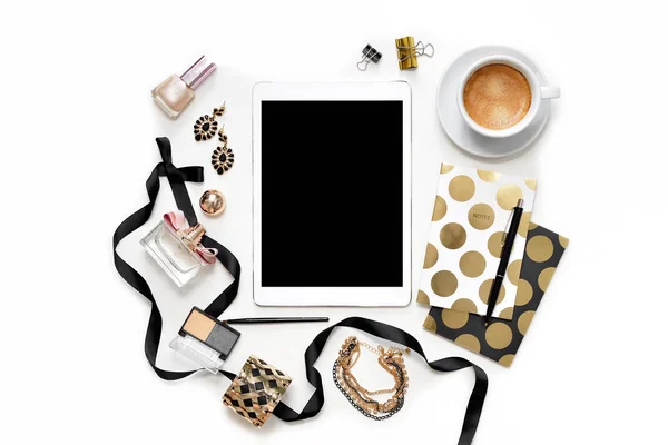 Flat lay fashion feminine home office workspace with tablet, cup of coffee, stylish black gold notebooks, cosmetics and jewelry on white background. Top view on women's business work desk — Stock Photo, Image