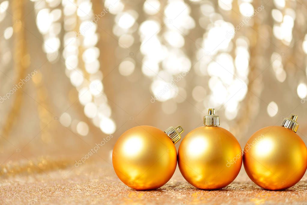 Christmas gold balls in winter setting,Winter holidays concept.