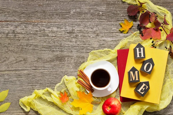 Autumn set of red, green and yellow leaves, apples with cup of coffee or tea with books on vintage background. — Stock Photo, Image