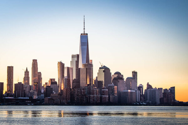 The World Trade Center stands over the rest of New York City's financial district in early morning