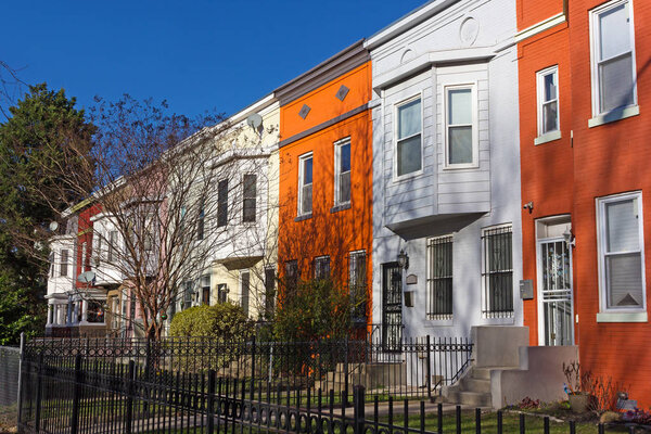 Historic townhouses in Shaw neighborhood on a quiet street.