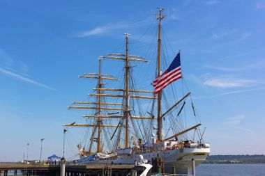 Alexandria welcomes a U.S. Coast Guard tall ship to its docks in Virginia, USA. The Cutter Eagle visits the city for four days as a part of East Coast tour and opens it to free public tours. clipart