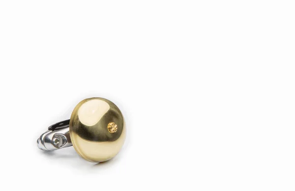 Golden bicycle bell on a white — Stock Photo, Image