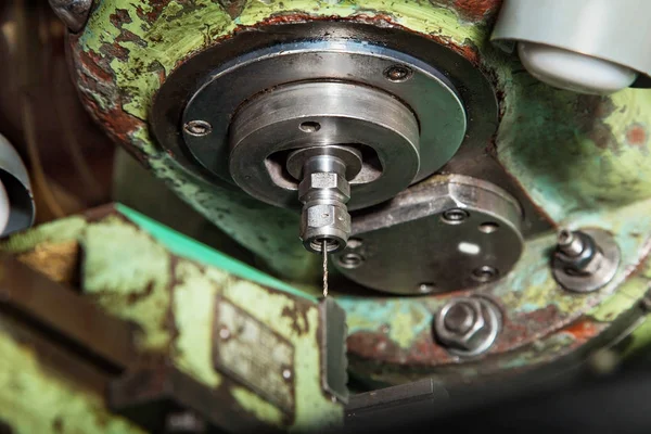 Thin drill in old milling machine — Stock Photo, Image