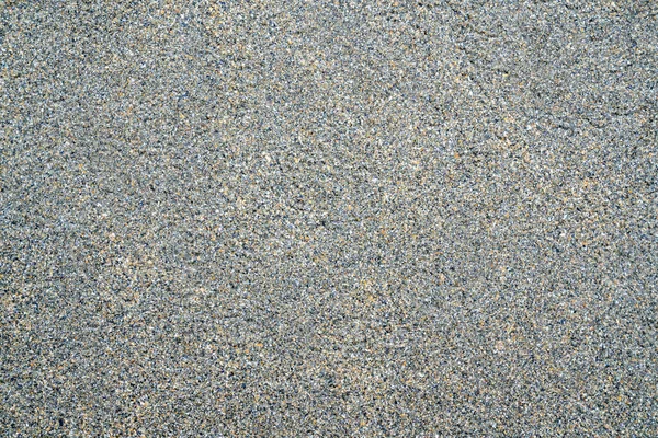 Sand background on the shore of ocean — Stock Photo, Image