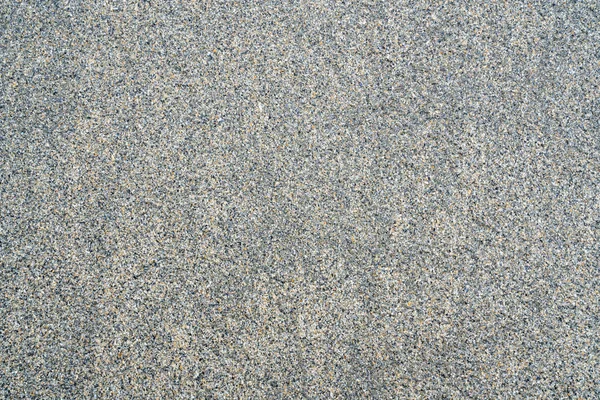 Sand background on the shore of ocean — Stock Photo, Image