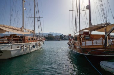 Ships and yachts in the harbour of Kos on sunny day