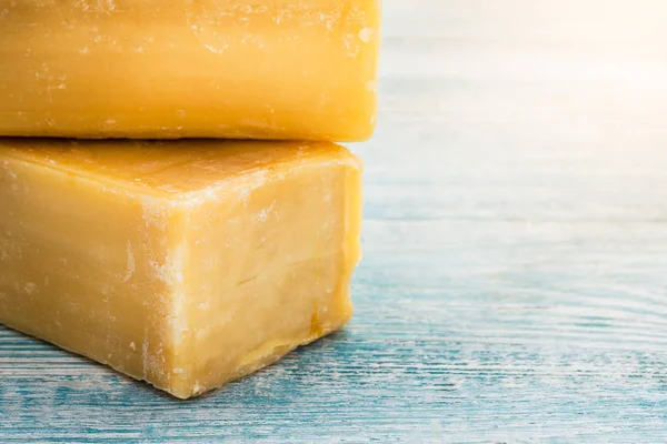 laundry soap for washing on wooden background