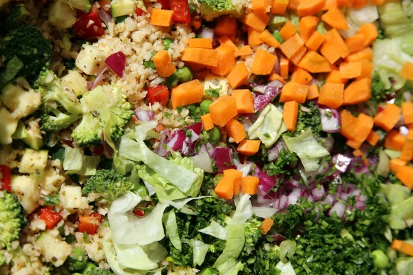 Colorful healthy salad ingredients on table as a background