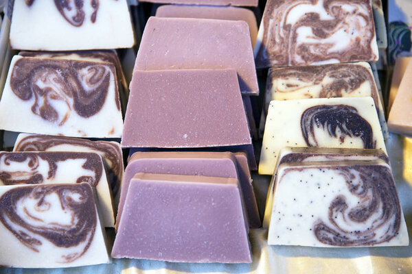 Stack of soaps on a market stall for sale