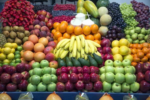 Big assortment of organic fruits on retail market — Stock Photo, Image