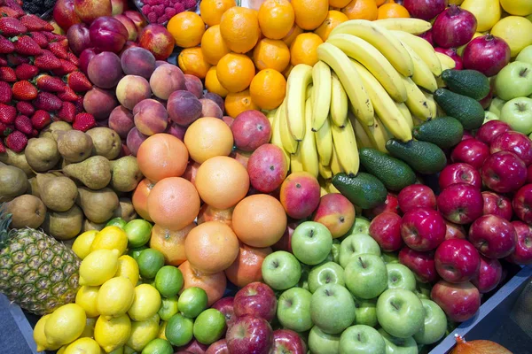 Big assortment of organic fruits on retail market — Stock Photo, Image