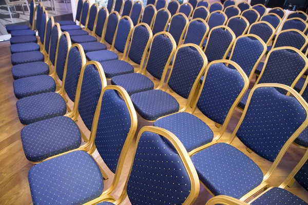Rows of blue seats in unknown event hall — Stock Photo, Image