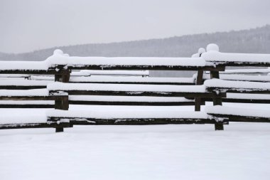 Photo of a fafulous snowy corral as a winter background clipart