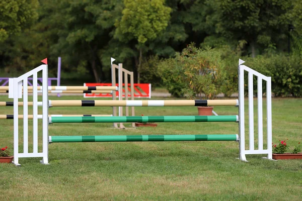 Colorful barriers on the ground for jumping horses and riders — Stock Photo, Image