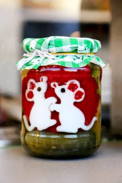 Funny preserves vegetables in glass jars. — Stock Photo, Image