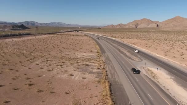 Cars and trucks traveling through desert — Stock Video