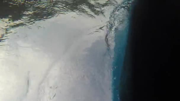 Bottom of sea kayak on surface of ocean — Stock Video