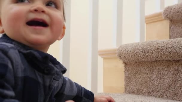 Baby learning to climb the stairs in home — Stock Video