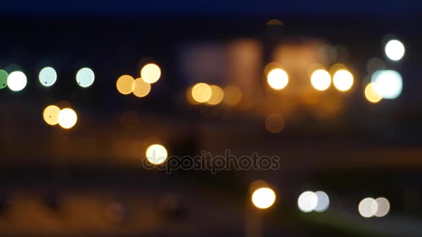 Luces de la ciudad por la noche fuera de foco — Vídeos de Stock