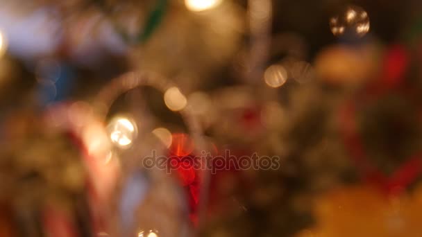 Christmas ornaments on tree macro shot — Stock Video