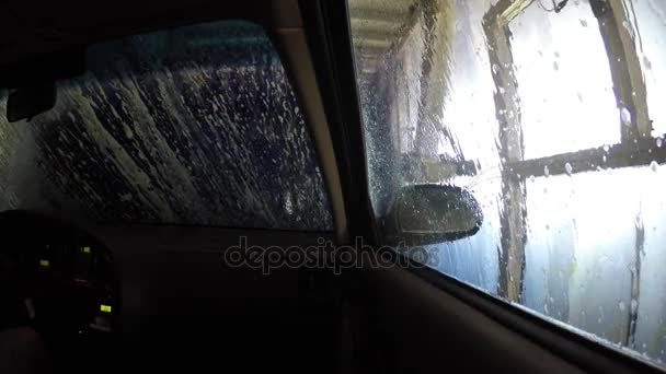 An interior of a car as it is cleaned in a car wash — Stock Video