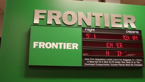 Frontier airport sign with information — Stock Video