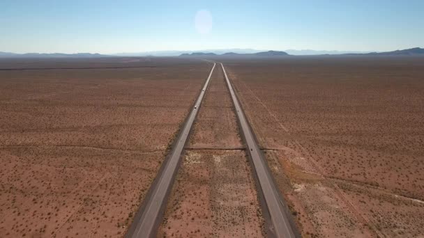 Cars and trucks traveling through desert — Stock Video