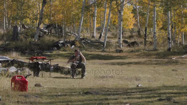 Man camping on an elk hunt — Stock Video