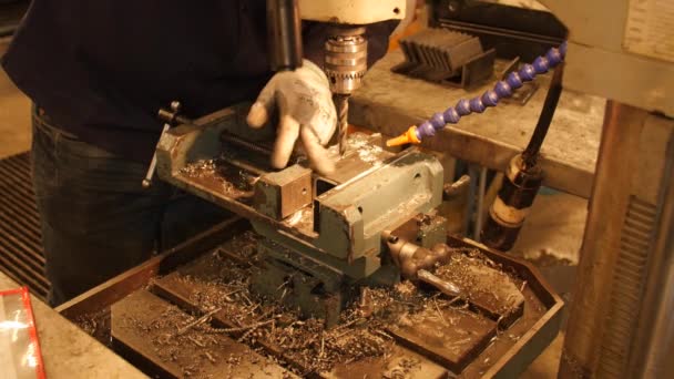 Man drills through thick metal — Stock Video