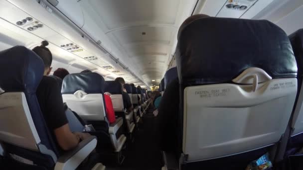 Travelers flying on a commercial airline — Stock Video