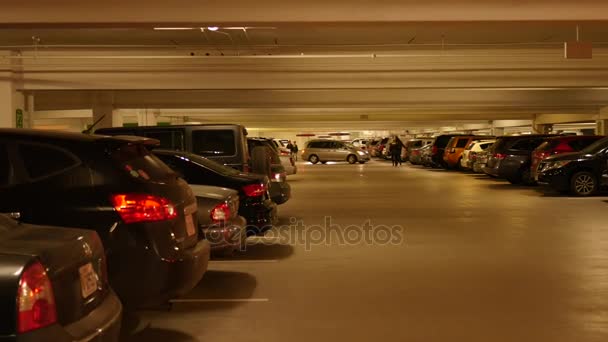 Underground parking garage with cars — Stock Video