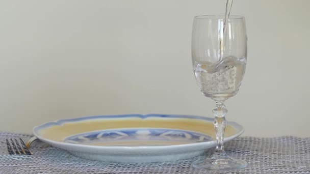 Pouring a glass of clear water from pitcher — Stock Video