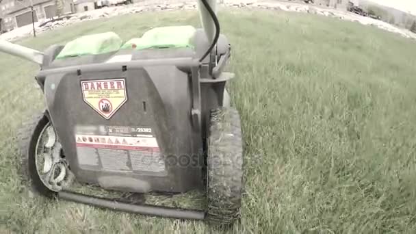 Mowing lawn with electric mower — Stock Video