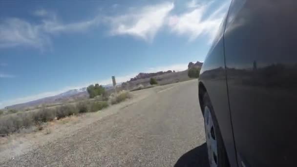 Exterior shot of car driving in desert — Stock Video