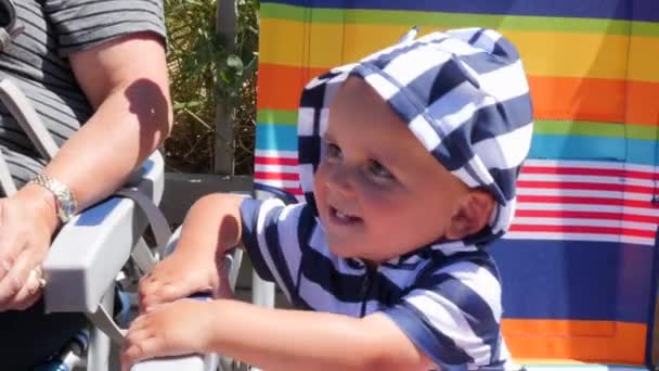 Toddler Boy Playing On Beach Chair — Stock Video