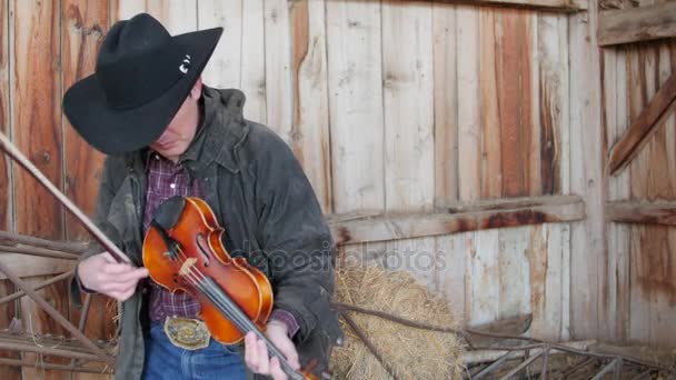 Cowboy playing fiddle — Stock Video