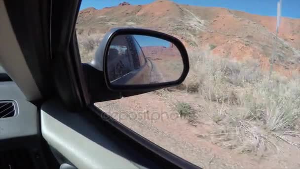 Looking in side mirror while driving — Stock Video