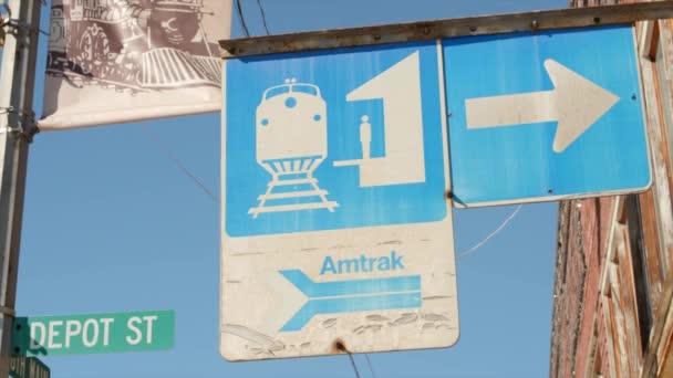 Amtrak train sign in a small town — Stock Video