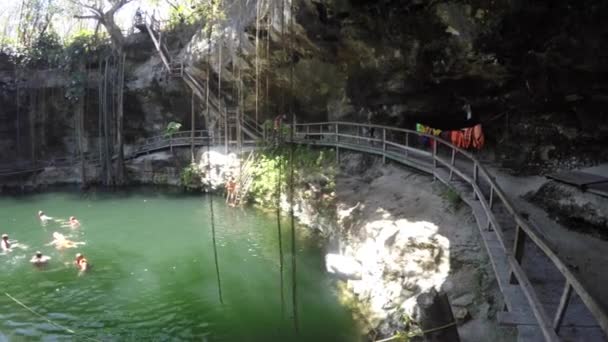 People swims in a cenote at Ek Balaam — Stock Video