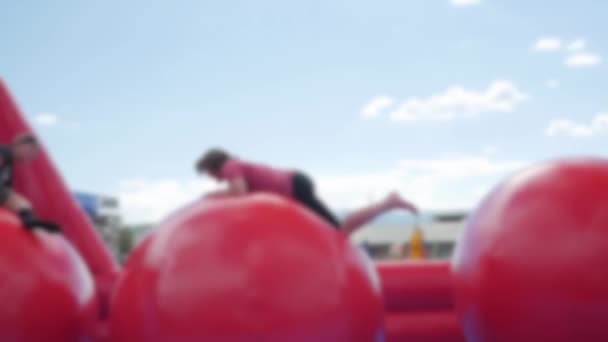 Teens Playing Wipeout At A Rural Fair — Stock Video