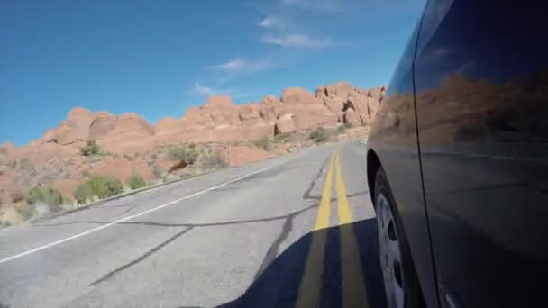 Exterior shot of car driving in desert — Stock Video