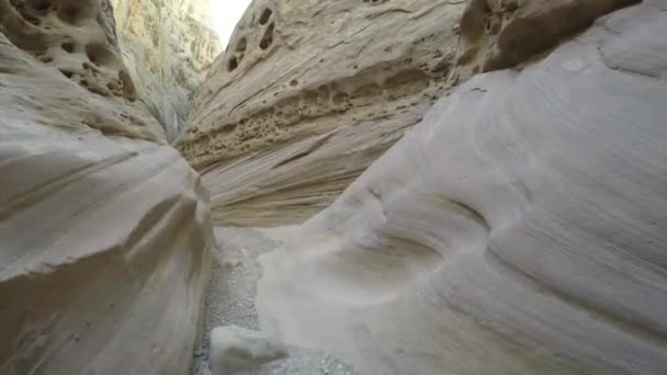 Tourists hike through a desert slot canyon — Stock Video