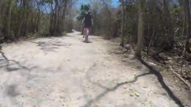 Couple Riding Bikes Dirt Path Mexican Jungle — Stock Video