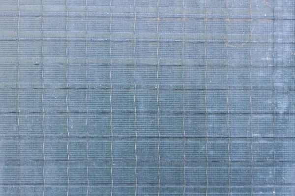 Dekoratif ve parlak cam blok mavi bir doku olarak veya arka plan için pencerede. Duvara. Geometrik arka plan.